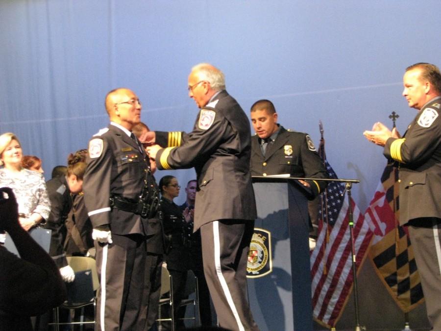 Dung Do receiving certification from Chief Gary Lyle on August 21st.