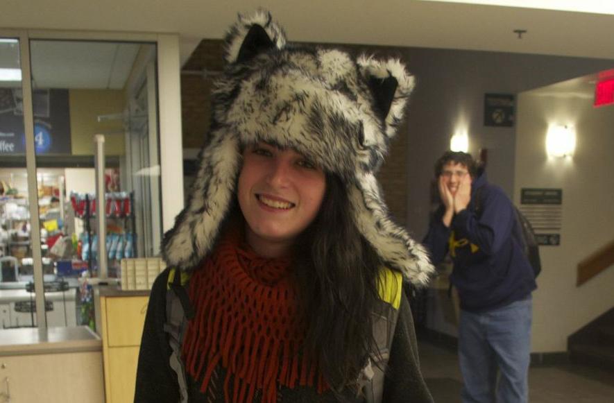 AACC student showing off her school spirit with wolf hat and a KickStart.

