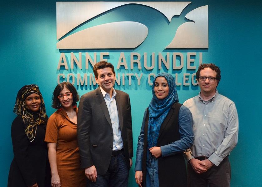 Dean Obeidallah & Negin Farsad pose for a group photo with AACC staff.