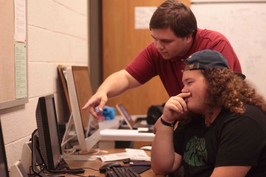 Editor-in-Chief Cody Colston (top) and Associate Editor Jesse Johnson (bottom) in action in the newsroom.