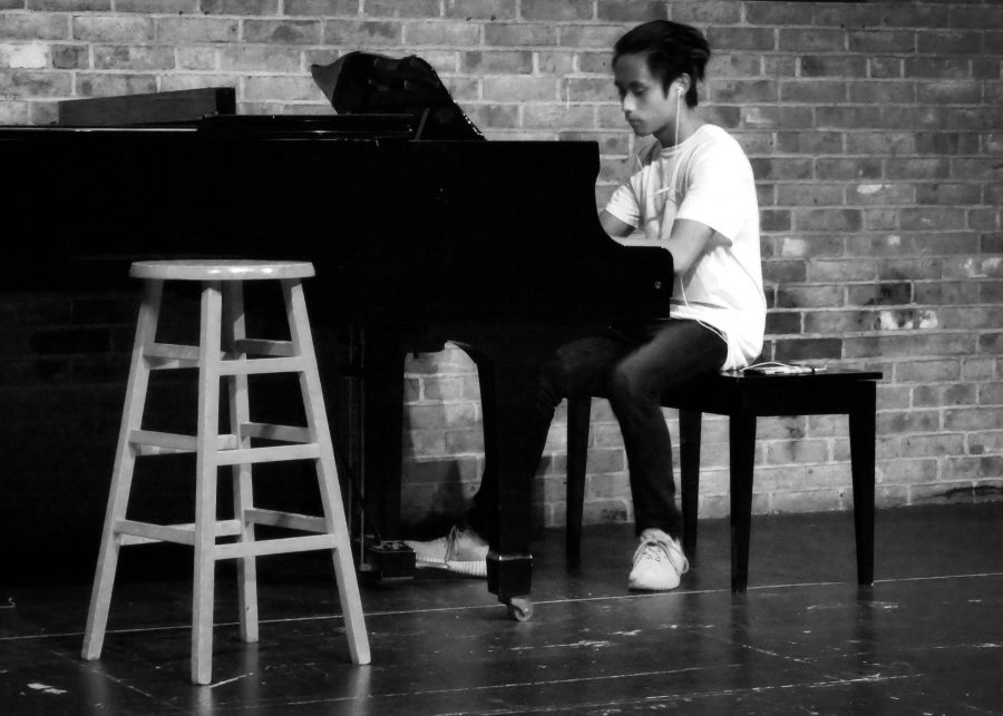 Austin Visk performs on the piano during October's Amaranth Coffee House.