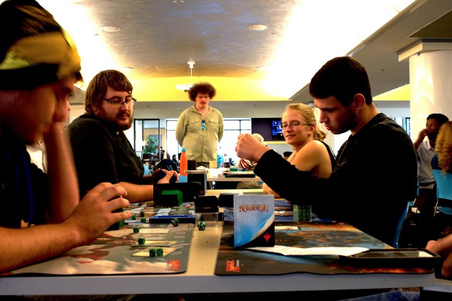 Students gather with friends in the Student Union building to play the fantasy-inspired card game, Magic: The Gathering.