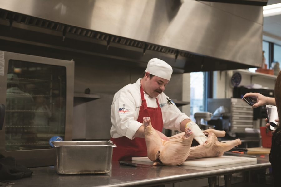 Culinary Institute butchers pig for demonstration