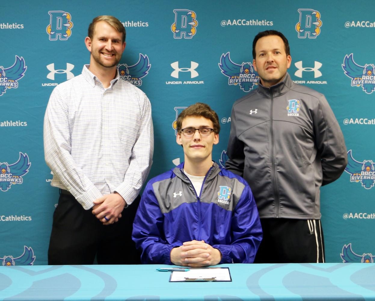 Athletics Director Duane Herr and Men's Soccer head coach Nick Cosentino welcome new signee Austin Nolan(goalie).