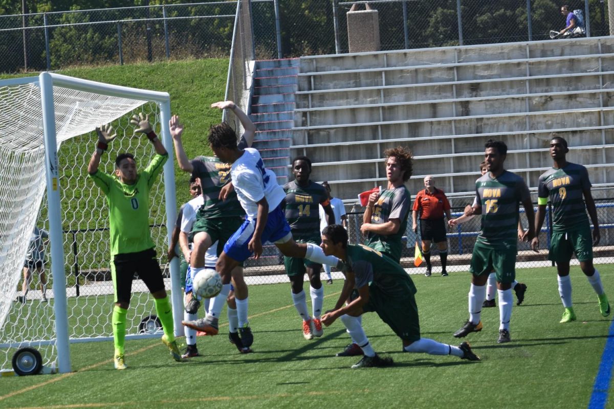 Keityn Pruett (center) scores a goal during a Men’s Soccer game against NOVA Community College. 