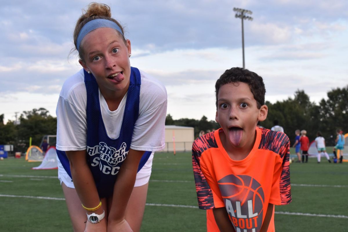 Jaclyn Mullan poses with kids from the community.