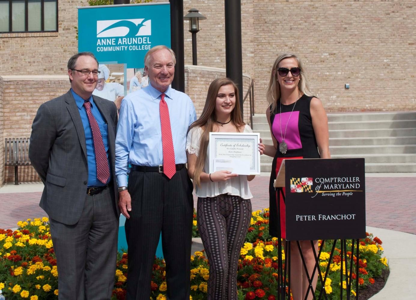 Dr. Mike Gavin, Vice President of Learning (left); Comptroller Peter Franchot; student winner Katie Huffman; and Cailey Locklair Tolle, president of the Maryland Retailers Association. Photo courtesy of Myles Gadsden, AACC Public Relations and Marketing Department.