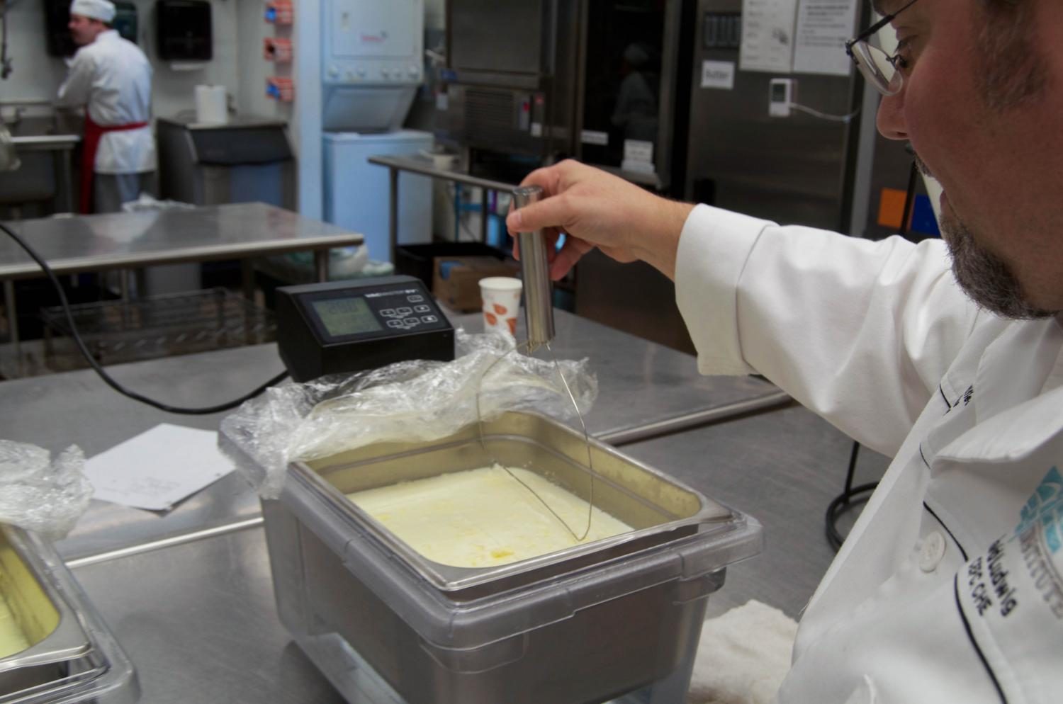 HCAT instructor, David Ludwig is showing a determination on how to make cheese. 