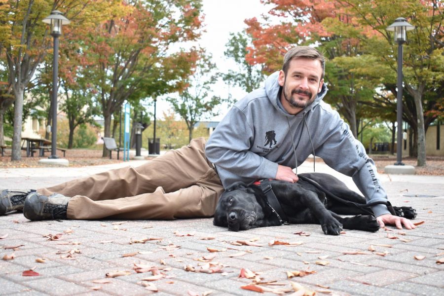 Michael Garvey, a U.S. Marine veteran—pictured here with his service dog, Liberty—believes NFL players should be free to kneel when the anthem is played.