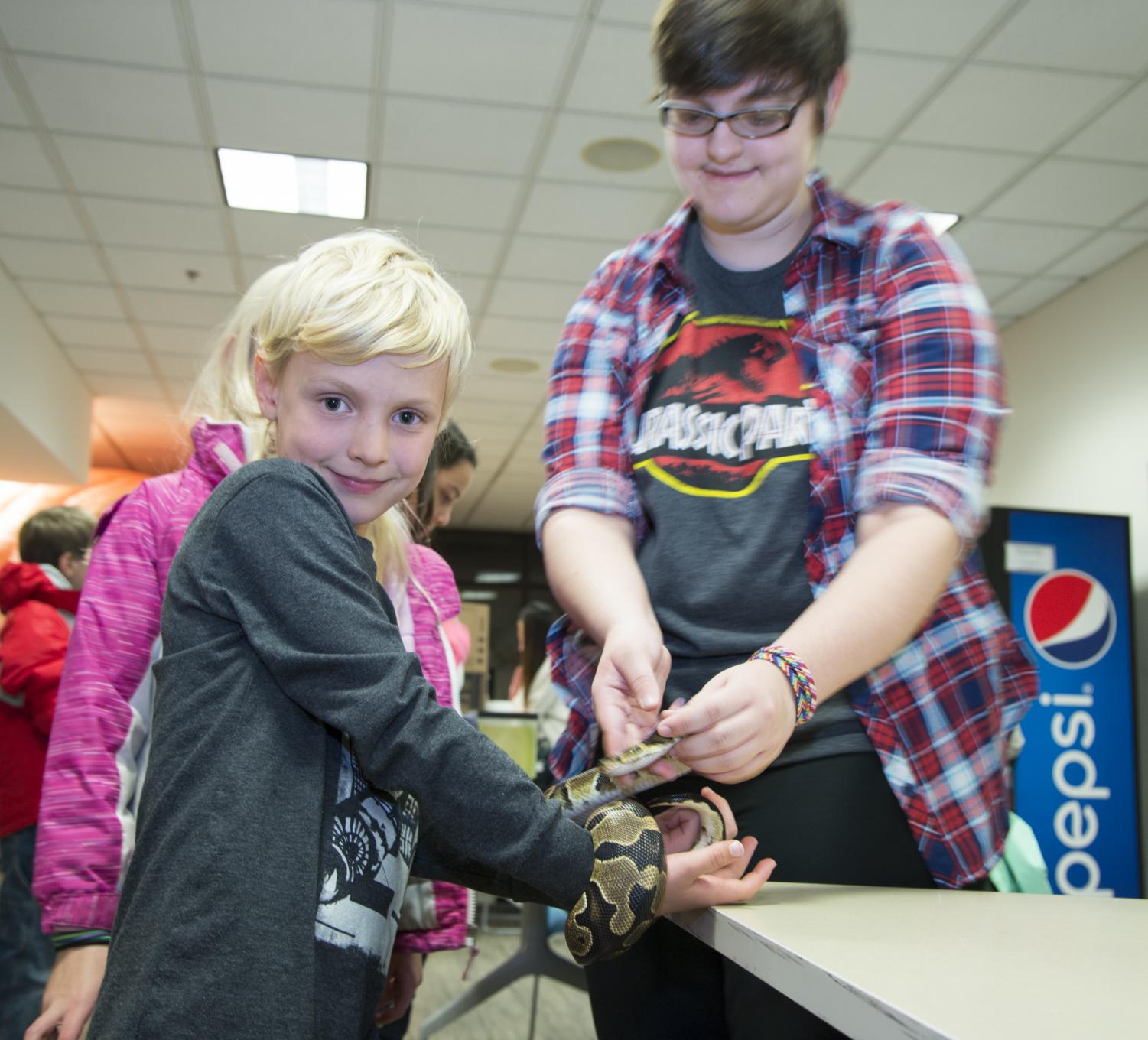Participants encounter insects and reptiles such as snakes, cockroaches and earthworms up-close and personal during AACC’s annual Science Night.
