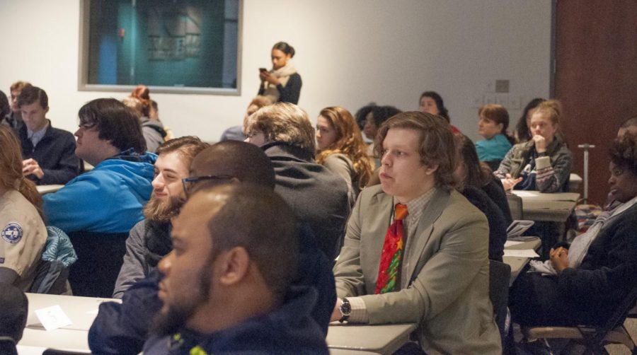 Students sat at tables with other clubs in their districts at the Dec. 4 meeting of the Student Advisory Council