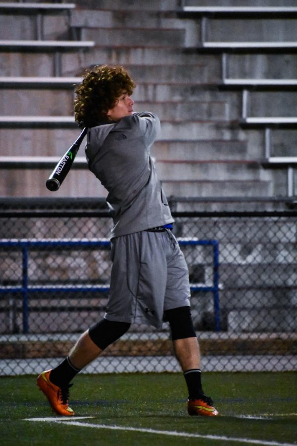 First-year student athlete Noah Ratsy swings during practice.
Photo by Raquel Hamner