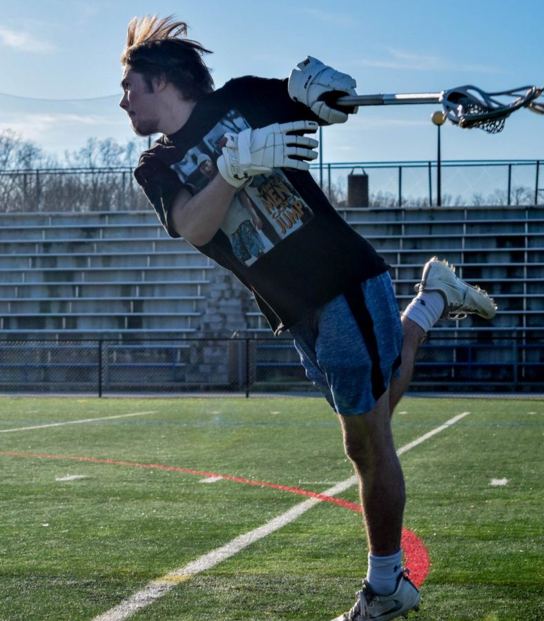 Lacrosse player Noah Reem shoots during practice.
Photo by Raquel Hamner