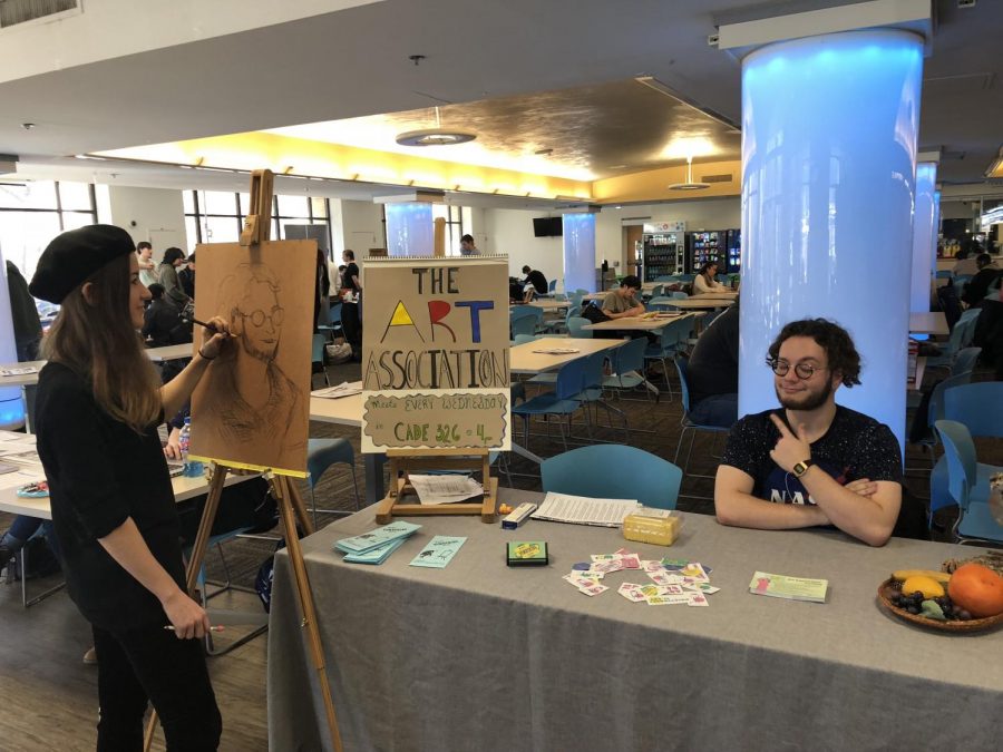 Kat Pfeiffer, a second year art student, and Chris Lins, the president of the Art Association, promoted their club at the Student Involvement Fair on Jan. 31.