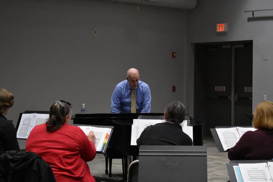 Performing Arts Chair Doug Byerly and the choir rehearse for a concert tour of Spain.
Photo by Daniel Salomon