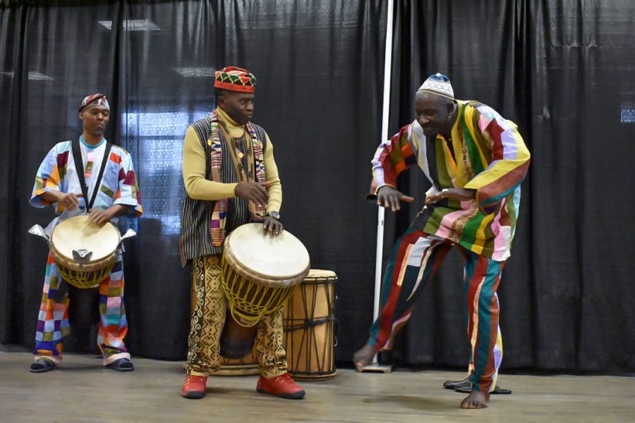 KanKouran+performers+teach+participants+how+to+play+traditional+African+drums.