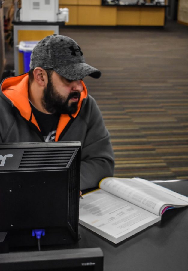 First-year transfer studies student Rooz Inanloo reads in the library.
Photo by Daniel Salomon