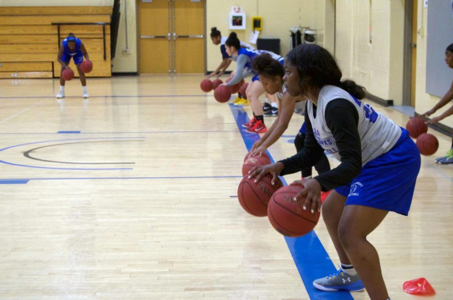 Women’s Basketball players practice for a game together before the season ends.
