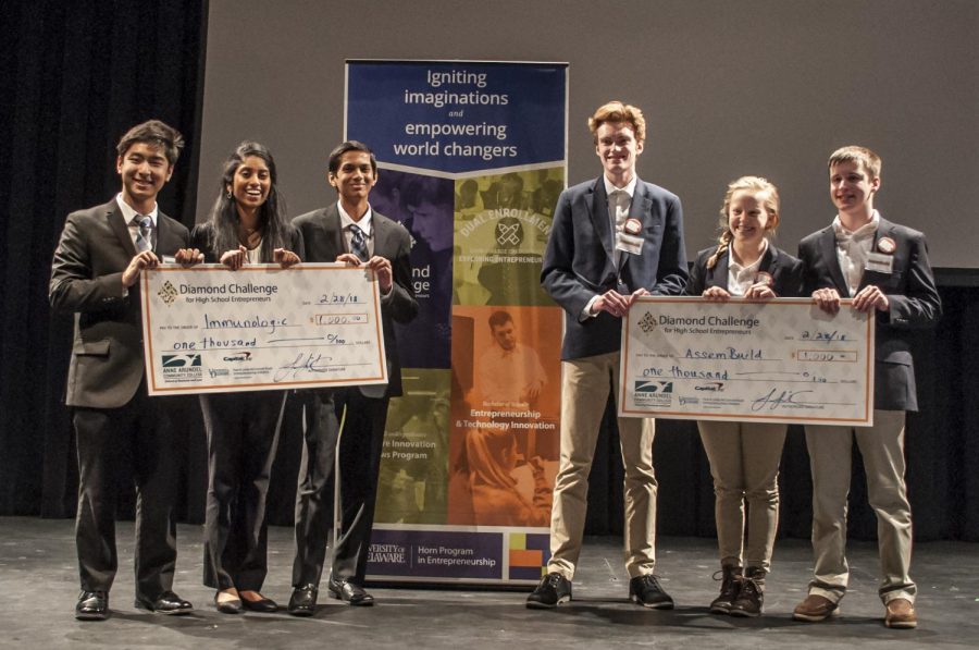 Immunologic Computing (right)—high school juniors Andrew Yu, Yashas Salankimatt and Shobha Dasari—and AssemBuild—junior Clare Hudak and seniors Matthew Lynerd and Collin Griffin—pose after winning the Diamond Challenge live pitch round at AACC.