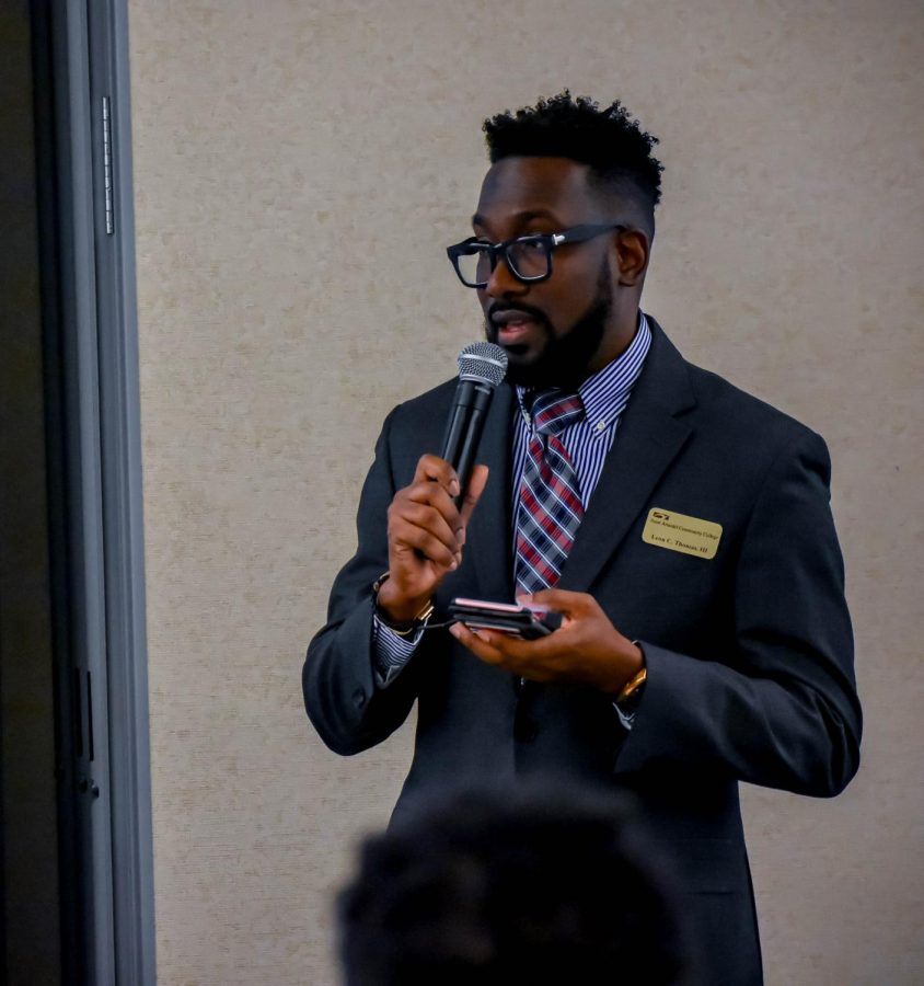 Program Manager Leon Thomas talks with minority students and community members during the Black Male Initiative Summit on campus in February.
