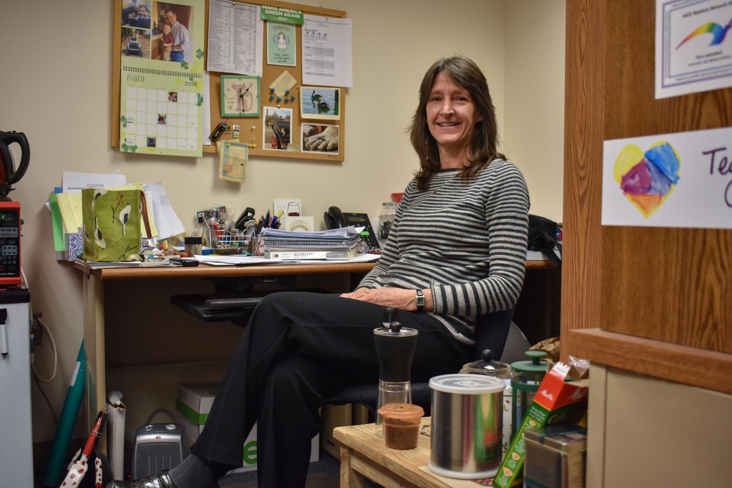 Nutrition professor Karen Israel has filled her office with items she has found a second use for, like Mason jars, plastic silverware and paper products.