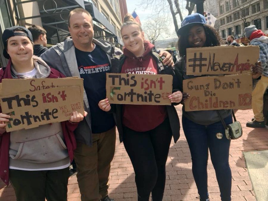 Jump Start student Ruth Stimely (third from left) marches with her father and friends.