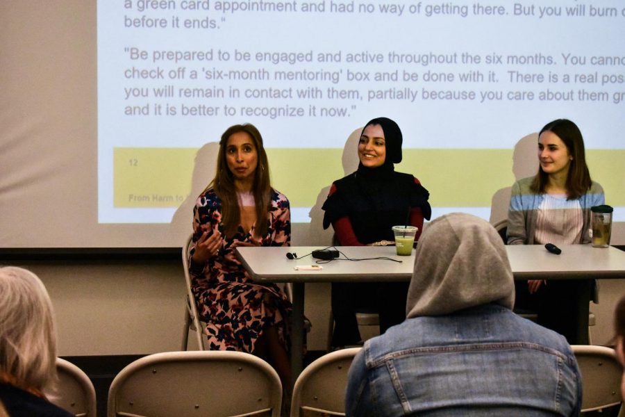 Maheem Taqui (left) and Nimra Kham give a lecture in CALT 100 at an immigration information session.
