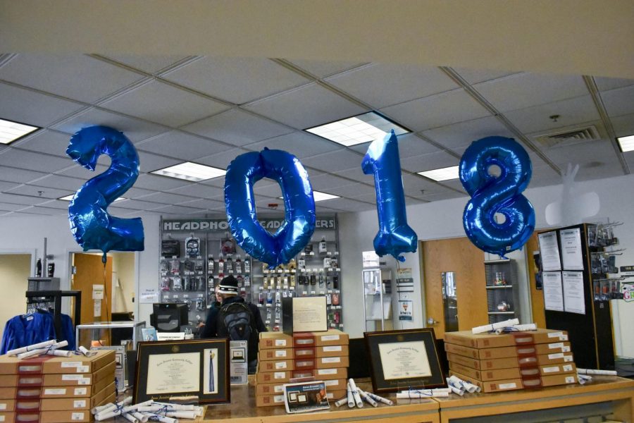 The campus bookstore sells caps and gowns and graduation souvenirs. Commencement will be on the Arnold practice field at 7 p.m. on May 24, rain or shine.