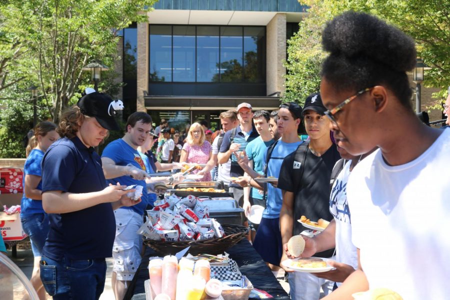 Student line up for free food during CABs cookout on the Quad. 