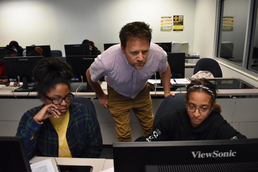 Professor Forrest Caskey teaches first-year interior design student Jalaya Stevens (left), and first-year physical therapy student Mariah Melendez.