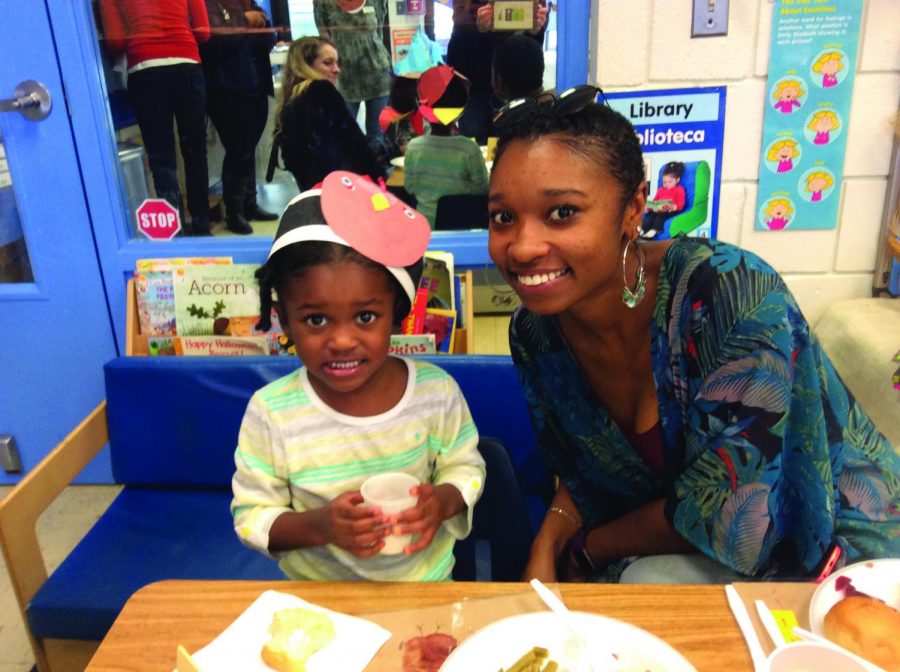 AACC student and mom Morgan Mitchell attends a Thanksgiving luncheon with her daughter Jade at the Child Development Center, which will offer free evening care next semester. 