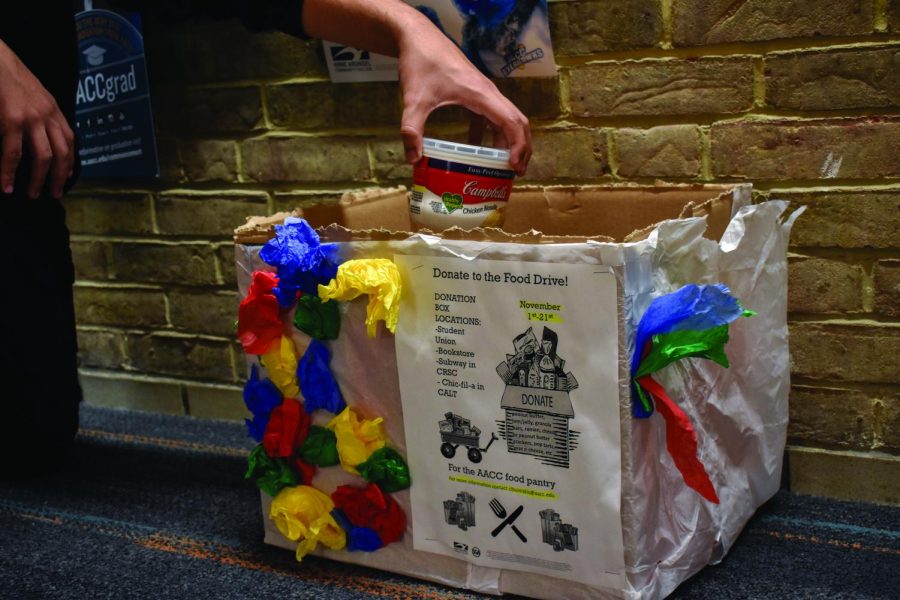 AACC alum and adjunct instructor Courtney Buiniskis’s communications students donate to the food pantry as part of a class project this semester.