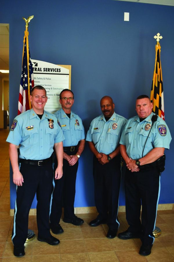 Police Chief Sean Kapfhammer (left) poses with three of the four former SWAT officers who work at AACC: Capt. Dave Pressley, Maj. Cleveland Smith and Officer Don Medtart.