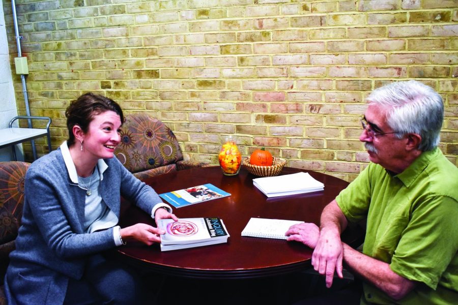 Dave Meng, the department chair for English and communications (right), and professor Candice Hill discuss upcoming English course changes.