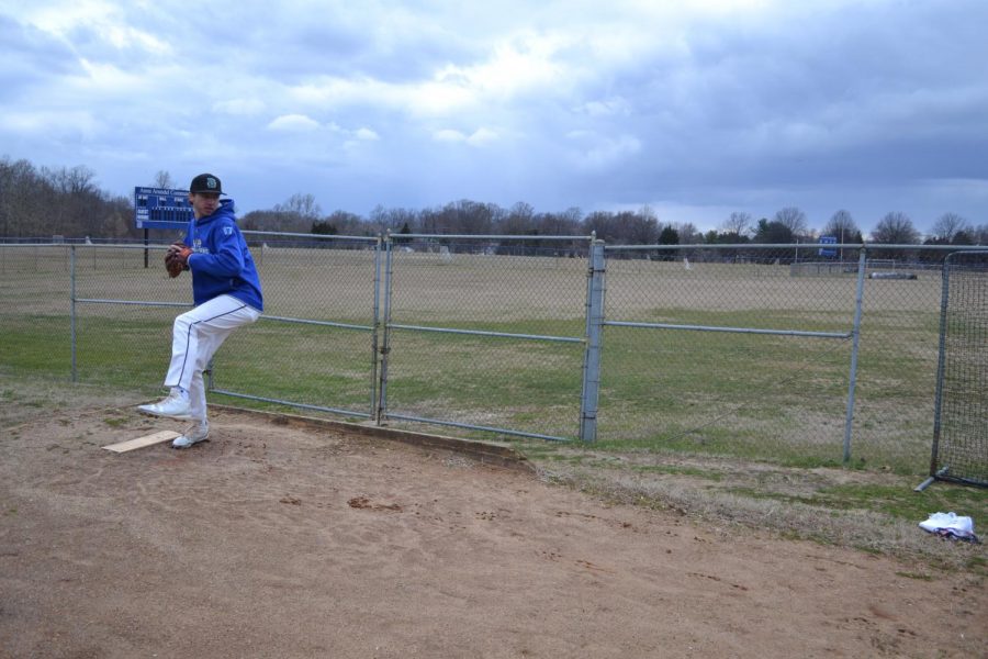ohn Iaquinta, a second-year business administration student and baseball pitcher, prepares for the 2019 spring season. 