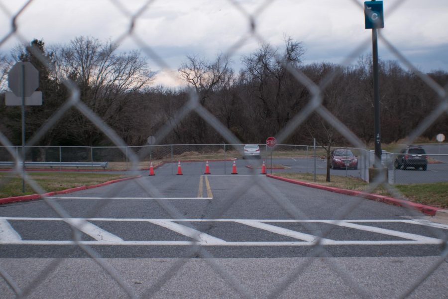 Construction on the Health and Life Sciences Building reroutes Ring Road through Lot C.