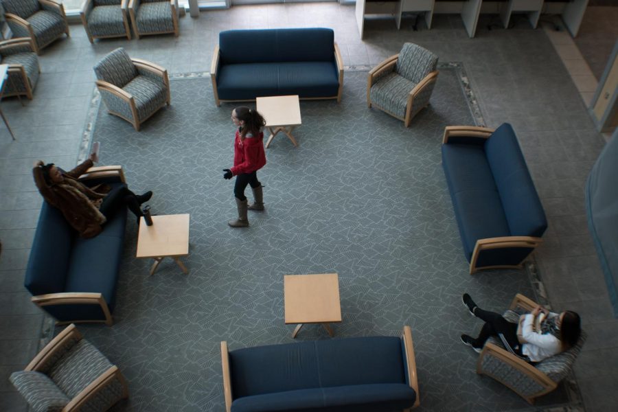 Students hang out in the lobby of the Student Services Building on the Arnold campus, located next to the financial aid office.