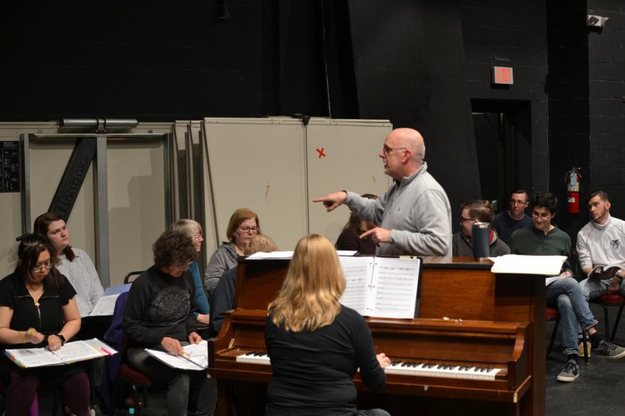 Professor Doug Byerly, who plays the lead role in “Sweeney Todd,” directs a rehearsal.