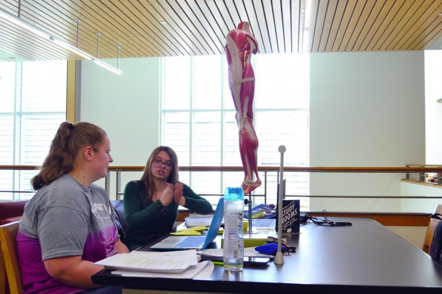 Allison Kral, a first-year phlebotomy student, and Hannah King, a first-year nursing student, took advantage of campus resources by borrowing a model of a leg.