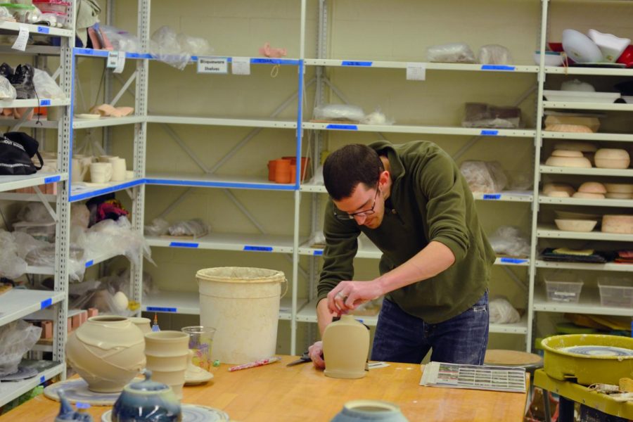 Chris Lively, a ceramics artist, works on his pottery.