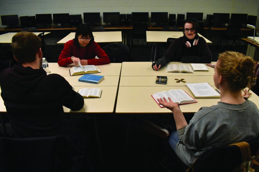 Students gather in the Humanities Building for a weekly Bible study meeting.