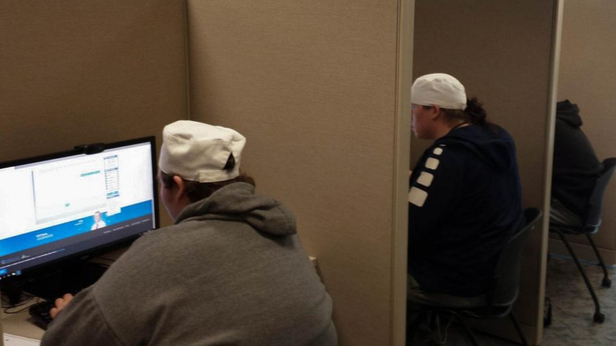 Culinary students, such as Nathan Lucas, a first-year student (left), edit resumes and search for jobs at today’s Job Search Cafe. 