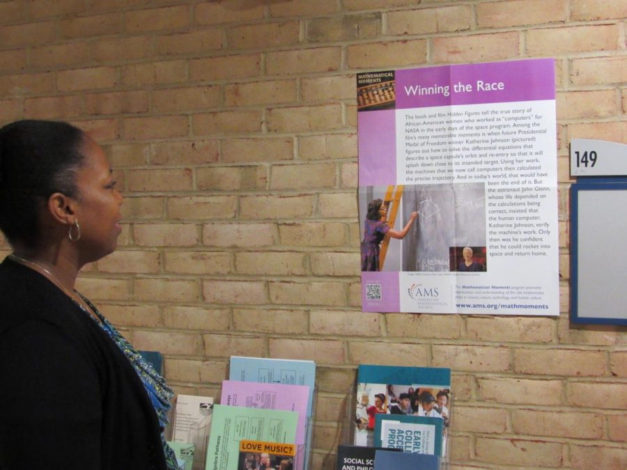 Math professor Dr. Stacey Nichols reads the history behind the film “Hidden Figures,” but says there is still work to do.