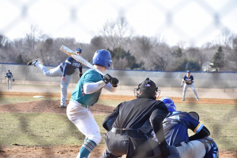 AACC baseball player lines up to bat against Prince George's Community College team.