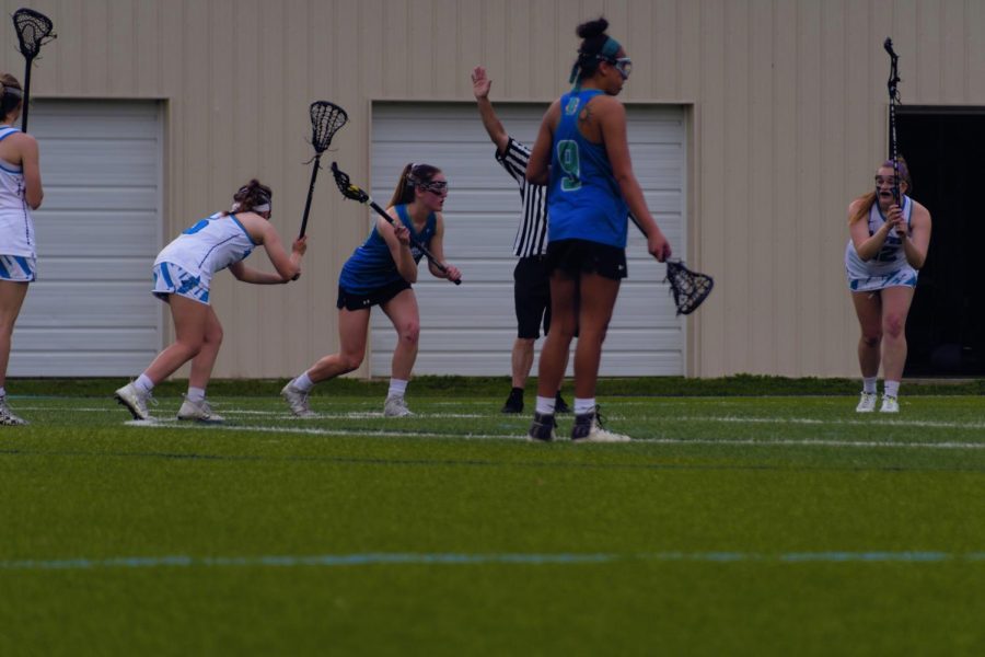 AACC Women’s Lacrosse players Mariah Scott and Natalie Sonntag battle against Harford Community College in their game on April 8.