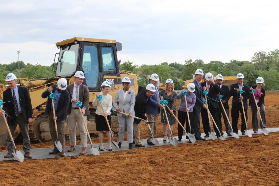 President Dawn Lindsay, County Executive Steuart Pittman and members of the college faculty, construction and Board of Trustees gathered infront of the muddy plot that will become the Health and Life Sciences building in August  2021