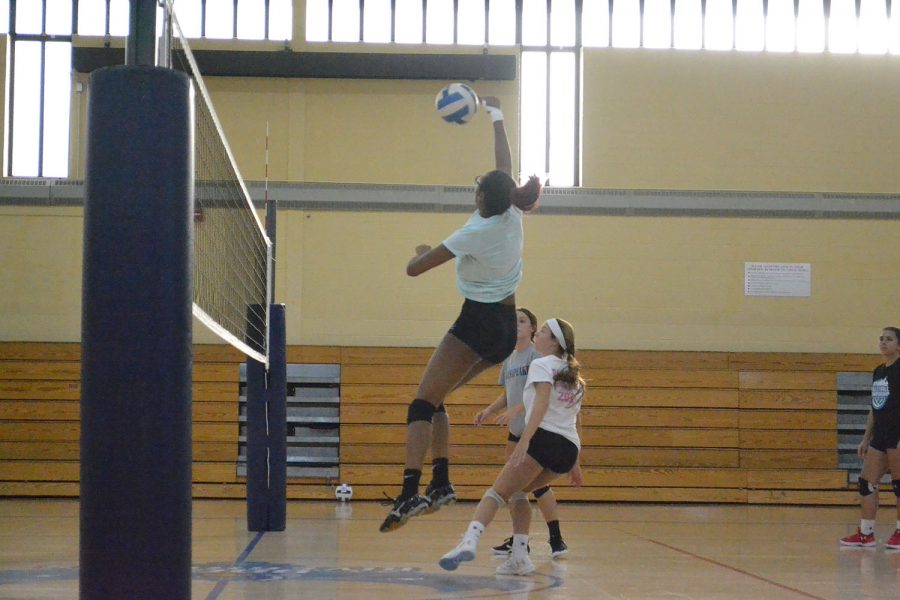 Middle Taliyah Johnson (left), setter Grace Lindemann, outside hitter Sylvia Frye and right side Tori Cain practice for the upcoming Women's Volleyball season. 