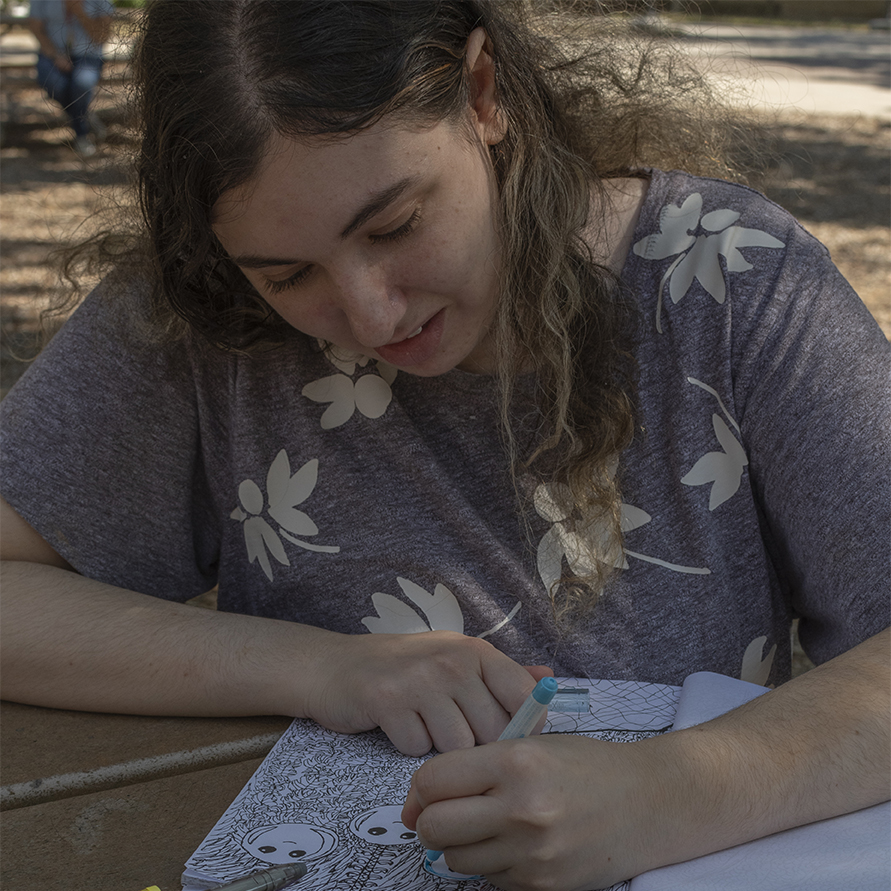 Art student with her new coloring book.