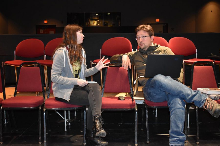 Lauryn Damron (left) and  professor Sean Urbantke help put together the performance.