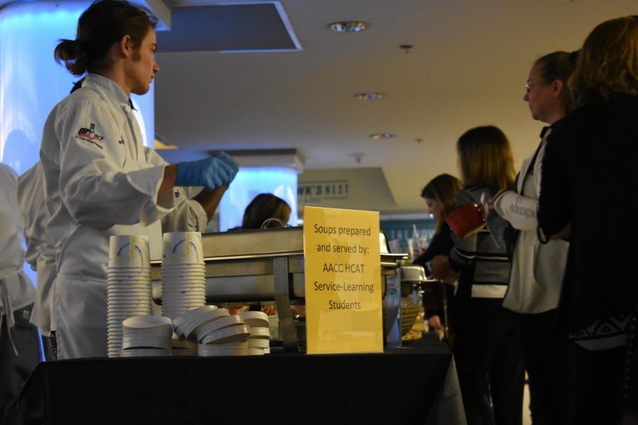 Culinary students serve soup to attendees at the Empty Bowls fundraiser